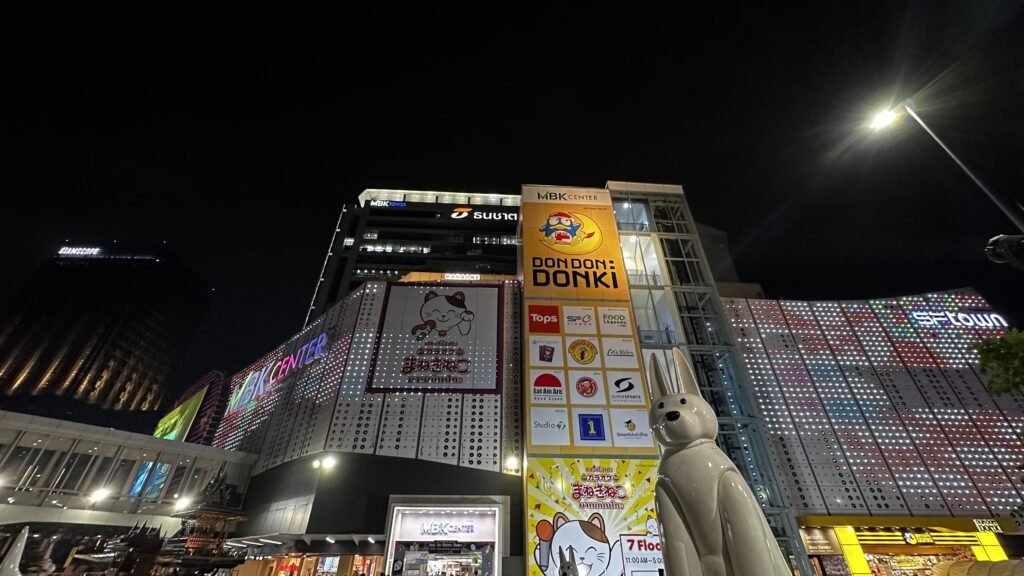 The front view of MBK Center nestled amidst bustling Phaya Thai Road