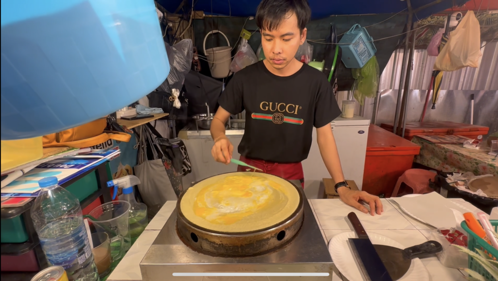 Adding egg to Thai banana cake