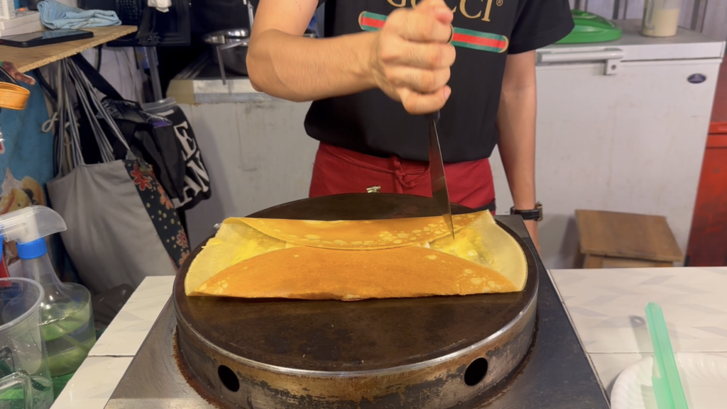 wrapping thai roti to make a square