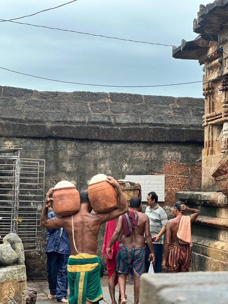 Sevayaks carrying prasad at Odisha temple